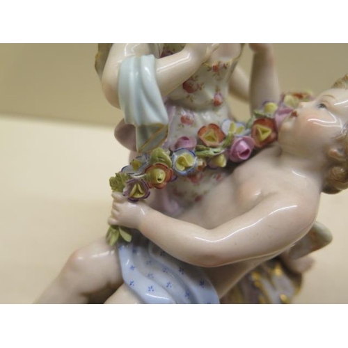 355 - A Meissen group boy Cupid and a young girl - Height 12cm - some foliate chipping to garland otherwis... 