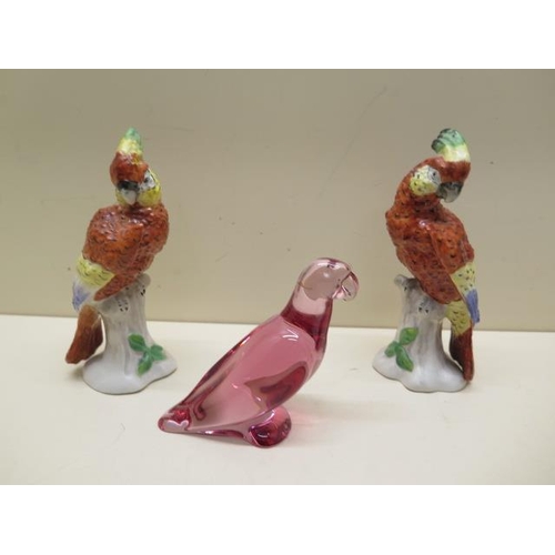 377 - A Baccarat glass parrot - Height 10cm - and a pair of porcelain Cockatoos - all good