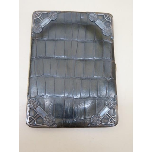 387 - A green crocodile skin card case with silver front corners - 14cm x 10cm - in usable condition