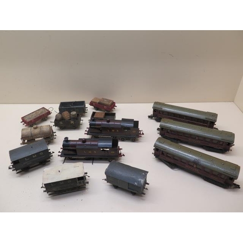 Three early tinplate Marklin OO gauge coaches, two 0-4-4 locos (make unknown) and nine wood and metal wagons - condition: two coaches generally good, the other has some rusting, wagons have wear and paint loss, Locos have not been tested