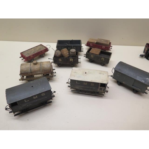 407 - Three early tinplate Marklin OO gauge coaches, two 0-4-4 locos (make unknown) and nine wood and meta... 