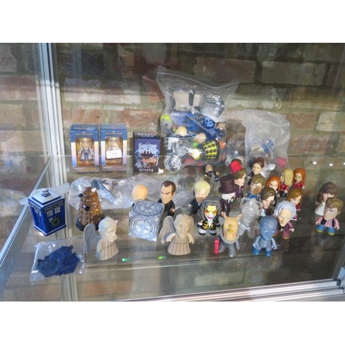 414 - A collection of Dr Who Titan vinyl figures - two boxed - please see images for vendors list