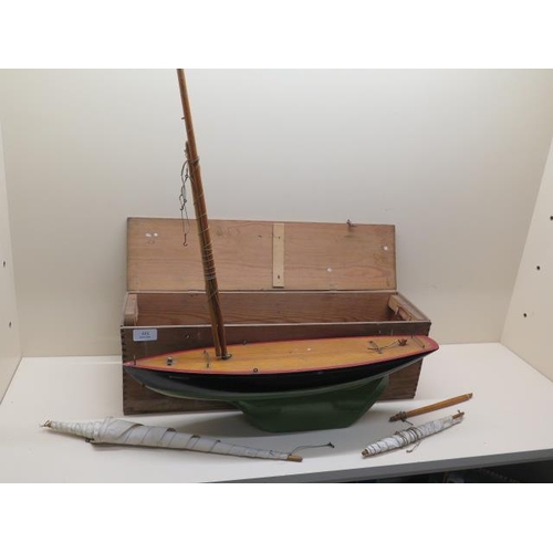 421 - A Tri-ang wooden pond yacht - Shamrock - 53cm long with original box - crack to keel, otherwise gene... 