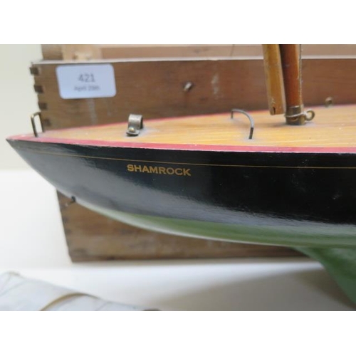 421 - A Tri-ang wooden pond yacht - Shamrock - 53cm long with original box - crack to keel, otherwise gene... 