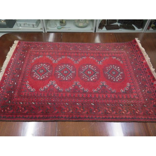 507 - A vintage handmade rug - 118cm x 77cm