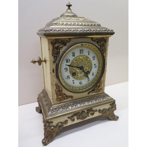 531 - A 19th century 8 day mantle clock with an attractive painted tin and ormolu case striking on a bell ... 