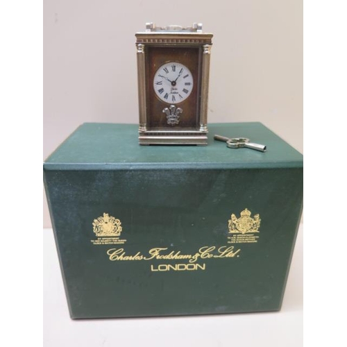 532 - A miniature carriage clock by Charles Frodsham in its original box - Height 19cm - not working