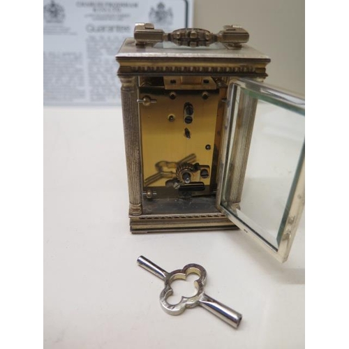 532 - A miniature carriage clock by Charles Frodsham in its original box - Height 19cm - not working