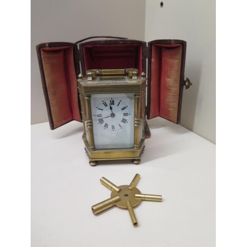 533 - A brass hexagonal carriage clock - Height 12cm with handle down in original case with a spider key -... 