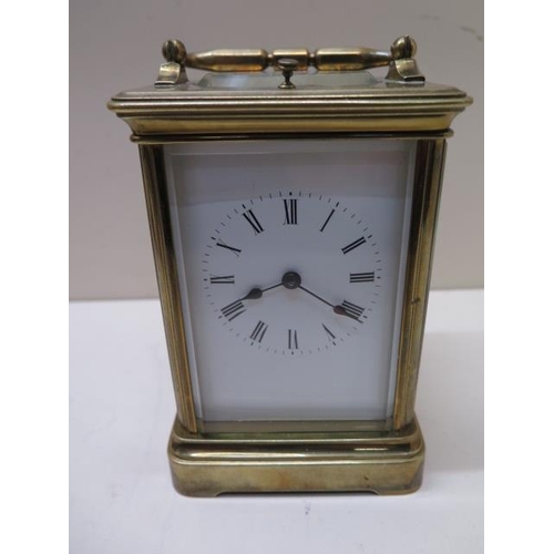 536 - A good quality brass carriage clock striking on a gong - working in saleroom - Height 19cm