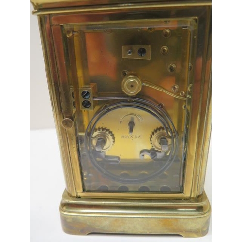 536 - A good quality brass carriage clock striking on a gong - working in saleroom - Height 19cm