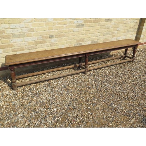 546 - A late 19th/20th century oak college bench on six turned legs - Length 256cm x Height 49cm