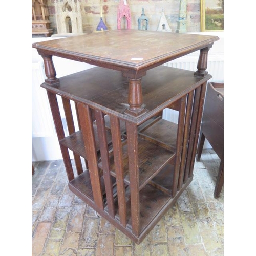 547 - A 1920's oak revolving bookcase - Height 115cm x 66cm square