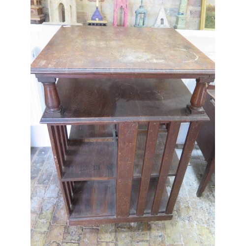 547 - A 1920's oak revolving bookcase - Height 115cm x 66cm square