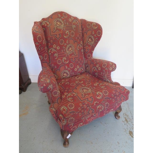 553 - A 1930's wing armchair