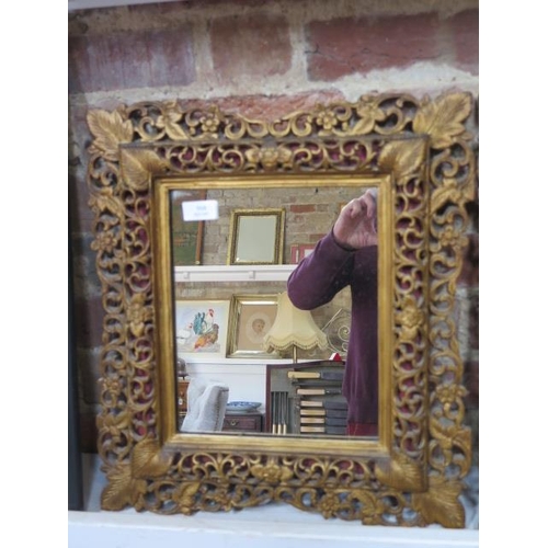 558 - A pair of carved giltwood mirrors - 49cm x 44cm - both good condition