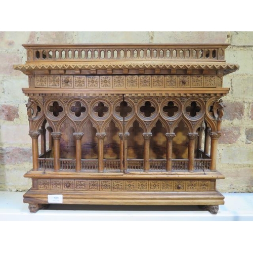 559 - An interesting carved wooden Ecclesiastical wall display cabinet with two drawers and two doors - He... 