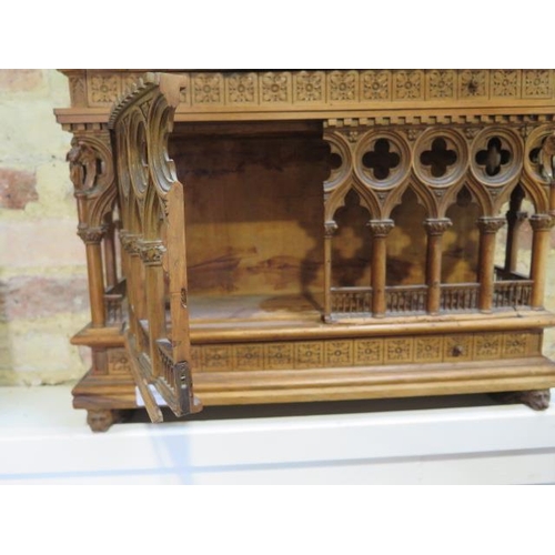 559 - An interesting carved wooden Ecclesiastical wall display cabinet with two drawers and two doors - He... 