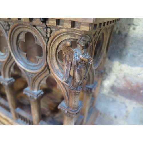 559 - An interesting carved wooden Ecclesiastical wall display cabinet with two drawers and two doors - He... 