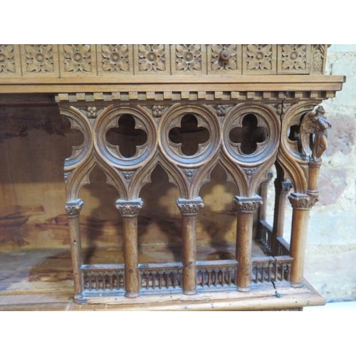 559 - An interesting carved wooden Ecclesiastical wall display cabinet with two drawers and two doors - He... 