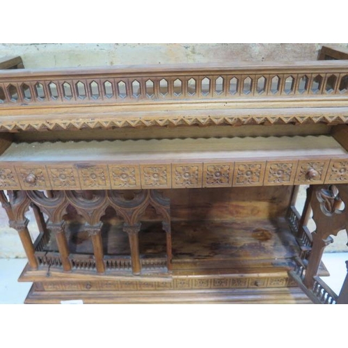 559 - An interesting carved wooden Ecclesiastical wall display cabinet with two drawers and two doors - He... 