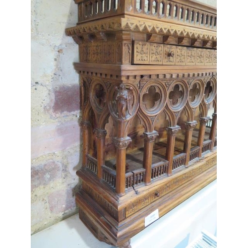 559 - An interesting carved wooden Ecclesiastical wall display cabinet with two drawers and two doors - He... 