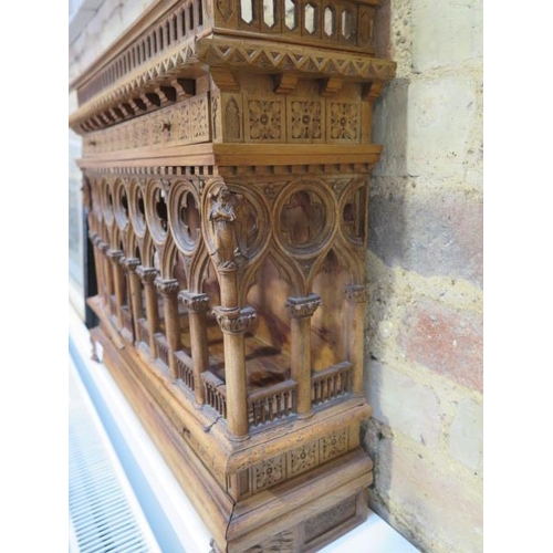 559 - An interesting carved wooden Ecclesiastical wall display cabinet with two drawers and two doors - He... 