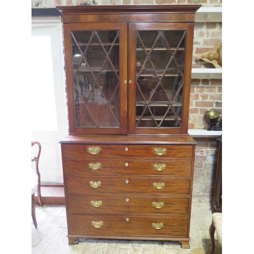 560 - A 19th century mahogany secretaire bookcase with a two door top having adjustable shelves above a fi... 