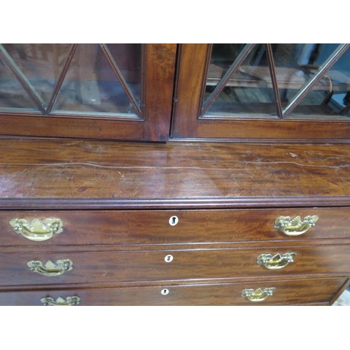 560 - A 19th century mahogany secretaire bookcase with a two door top having adjustable shelves above a fi... 