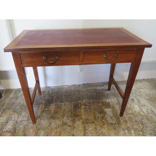 602 - A circa 1900's oak writing table with two frieze drawers on tapering legs - in polished condition - ... 