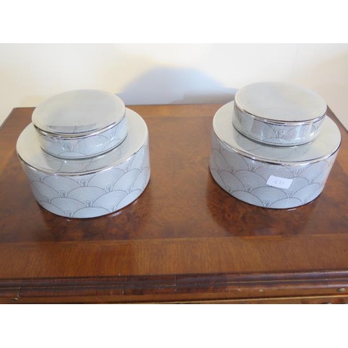 635 - A pair of Libra pots with lids