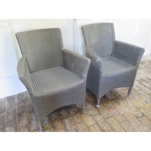 641 - A pair of Lloyd Loom style indoor chairs