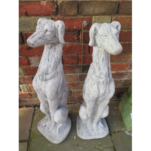 644 - A pair of cast stone seated whippets - Width 24cm x Height 80cm