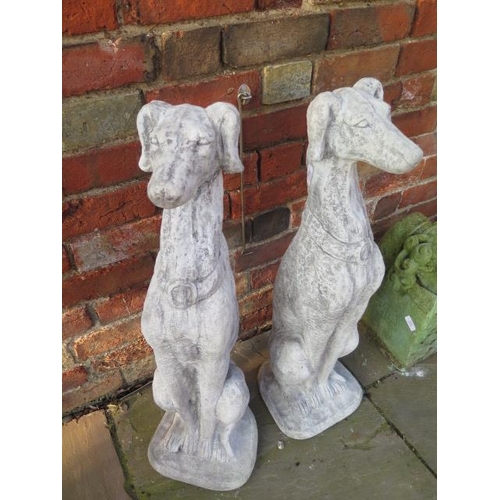 644 - A pair of cast stone seated whippets - Width 24cm x Height 80cm