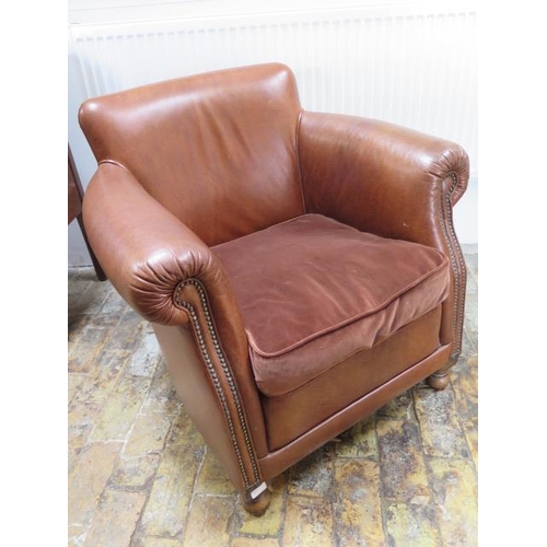 651 - A good quality modern leather club chair with tan leather studded upholstery - in good condition