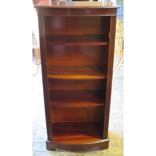 663 - A 20th century reproduction mahogany bow front open bookcase with three adjustable shelves - in poli... 