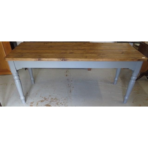 665 - A painted pine kitchen table with a waxed plank top - Height 77cm x 179cm x 70cm