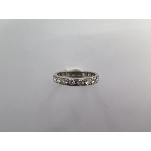 71 - A diamond full eternity ring consisting of twenty brilliant cut diamonds, grain set equidistant arou... 