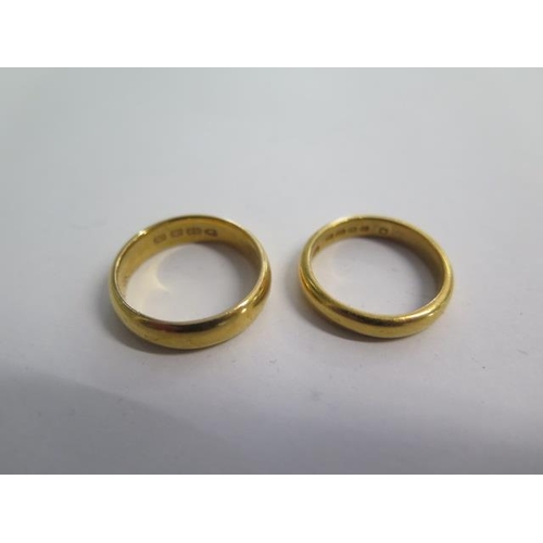 80 - Two 22ct hallmarked yellow gold band rings sizes O/M - total weight approx 13 grams