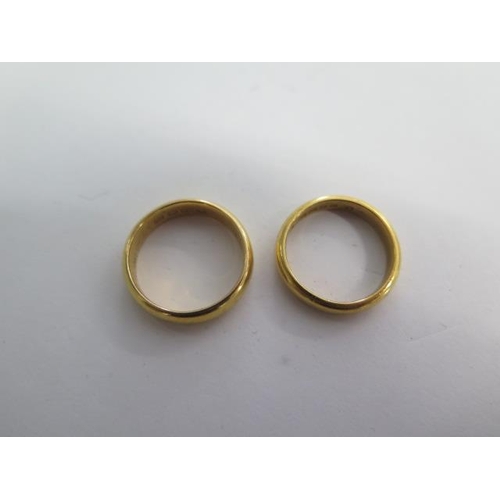 80 - Two 22ct hallmarked yellow gold band rings sizes O/M - total weight approx 13 grams