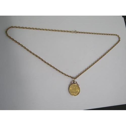 83 - A George V full gold sovereign dated 1915 in a 9ct pendant mount on a 58cm chain - total weight appr... 