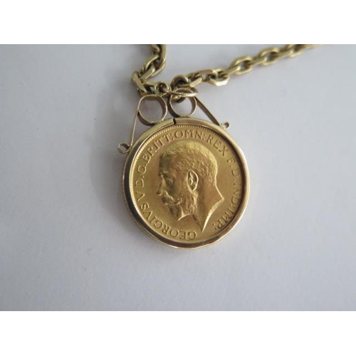 83 - A George V full gold sovereign dated 1915 in a 9ct pendant mount on a 58cm chain - total weight appr... 