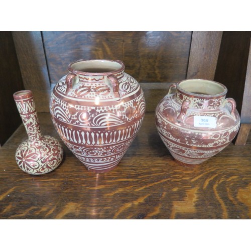 368 - Two Hispano-Moresque type ware copper lustre hanging vases and a bottle vase - Tallest 22cm - some m... 