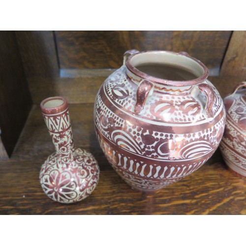 368 - Two Hispano-Moresque type ware copper lustre hanging vases and a bottle vase - Tallest 22cm - some m... 