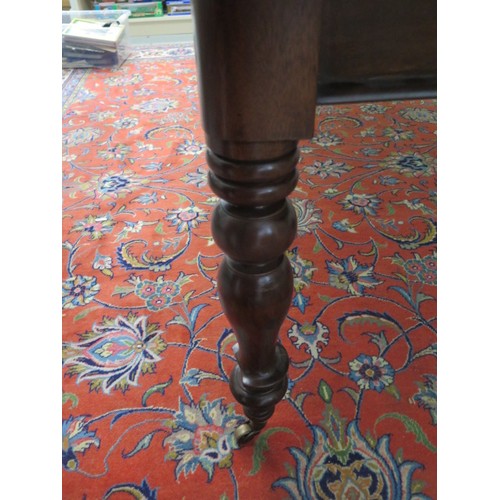 562 - A 19th century mahogany dining table with two leaves on turned legs - 240cm x 112cm extended, reduci... 