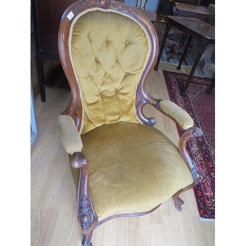 564 - A Victorian carved walnut button back open armchair - Height 96cm x Width 65cm