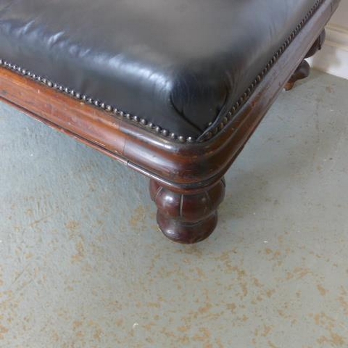 33 - A 19th century mahogany Midland Railway waiting room bench with buttoned leather upholstery on turne... 