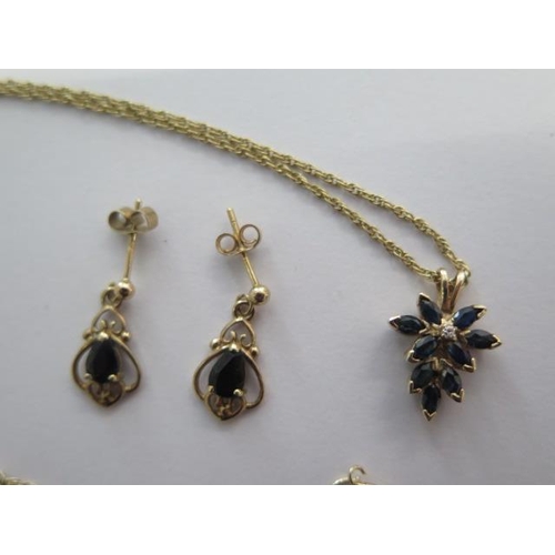 59 - A 9ct yellow gold sapphire pendant on a chain and a pair of sapphire earrings - total approx weight ... 