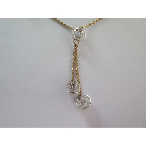 103 - A 9ct yellow gold Lariat necklace with white gold spheres - approx weight 4.5 grams - RRP £350 - ex ... 