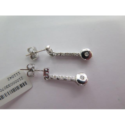 106 - A pair of white gold drop diamond earrings - 0.10pt each earring - 2cm long - approx weight 2 grams ... 